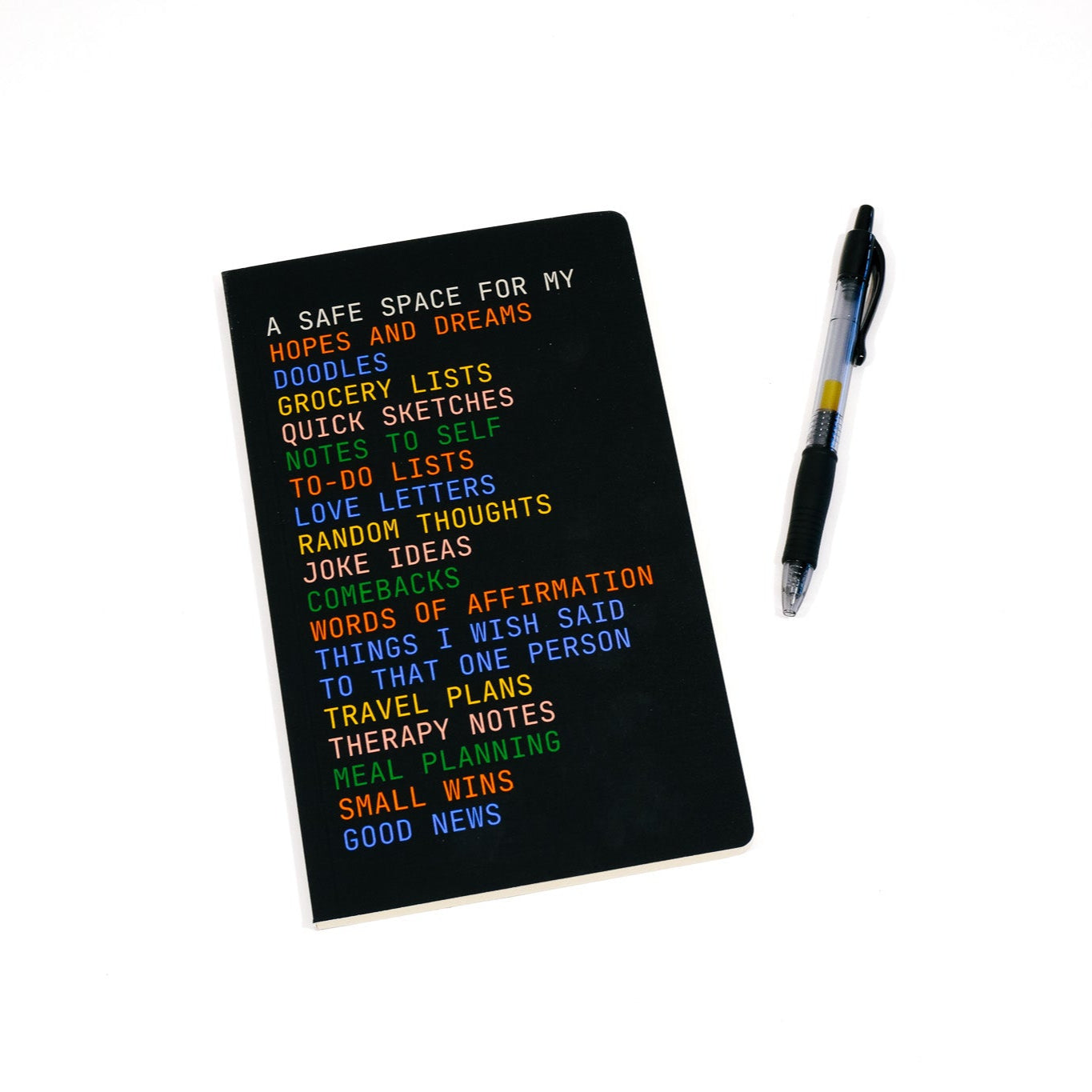 Black notebook with colorful text on a white background