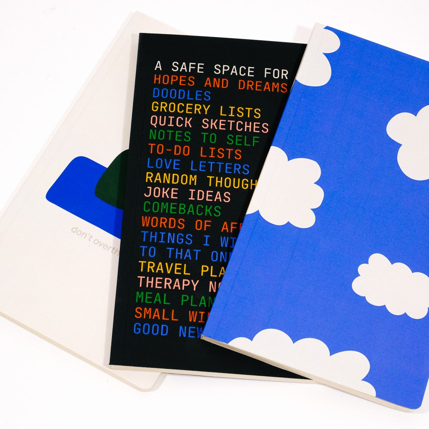 Notebook with cloud design and text on a white background