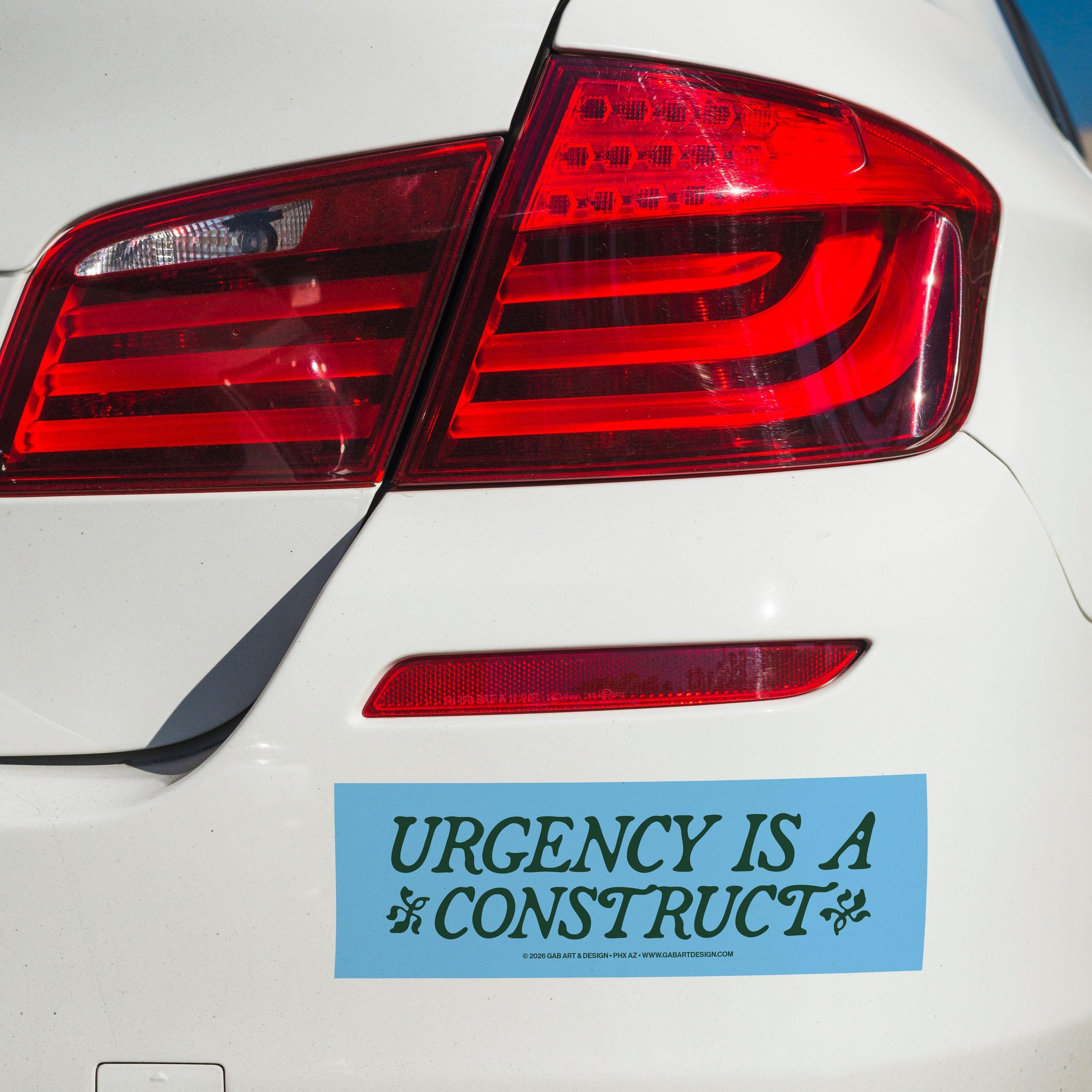 urgency is a construct bumper sticker / magnet